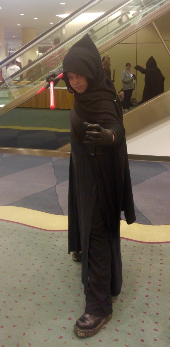 A cosplayer dressed up as Kylo Ren from Star Wars: The Force Awakens.