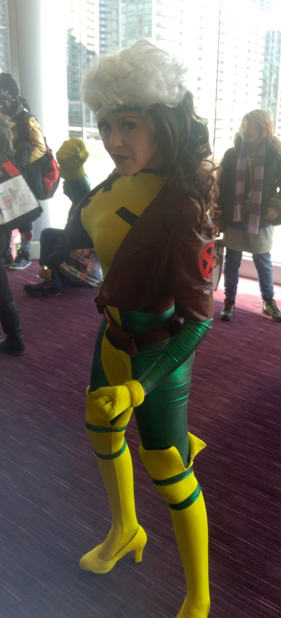 A cosplayer dressed as the 80's version of Rogue from Marvel's X-Men